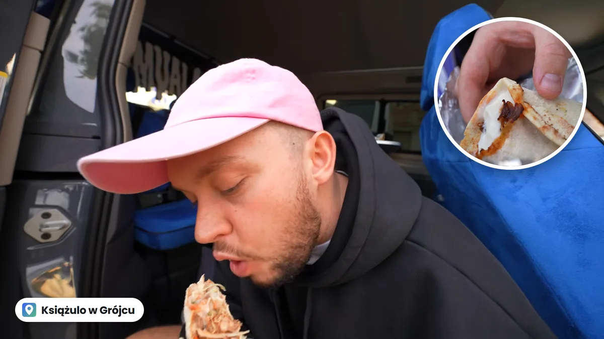 Książulo w różowej czapce gryzie odwróconą pitę w busie Pepsi, w kółku pita w folii z pastą i mięsem