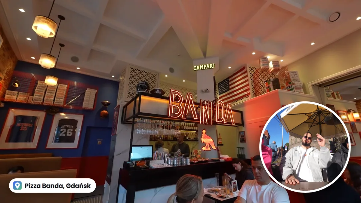 Wnętrze Pizza Banda w Gdańsku z neonem BANDA, w kółku Wojek przy stoliku pod parasolem